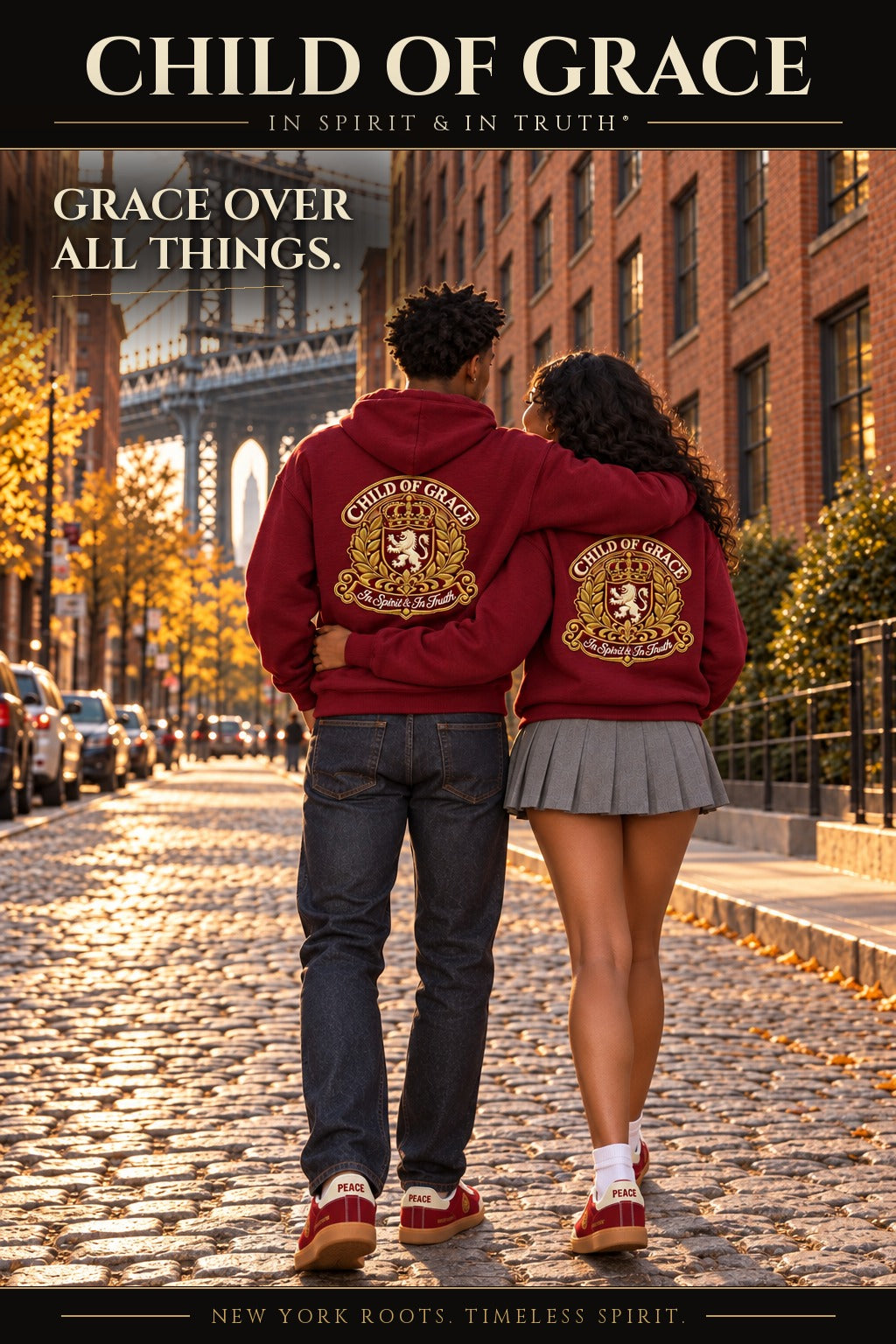 Back view poster: couple walking in burgundy Child Of Grace hoodies with the lion crest back print in DUMBO, headline Grace Over All Things