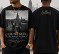 NYC Skyline Tee — Onyx. Empire State Building skyline print with gold crown lockup, Child Of Grace In Spirit & In Truth