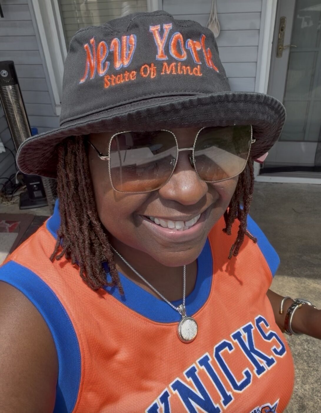 Model wearing the New York State of Mind embroidered bucket hat