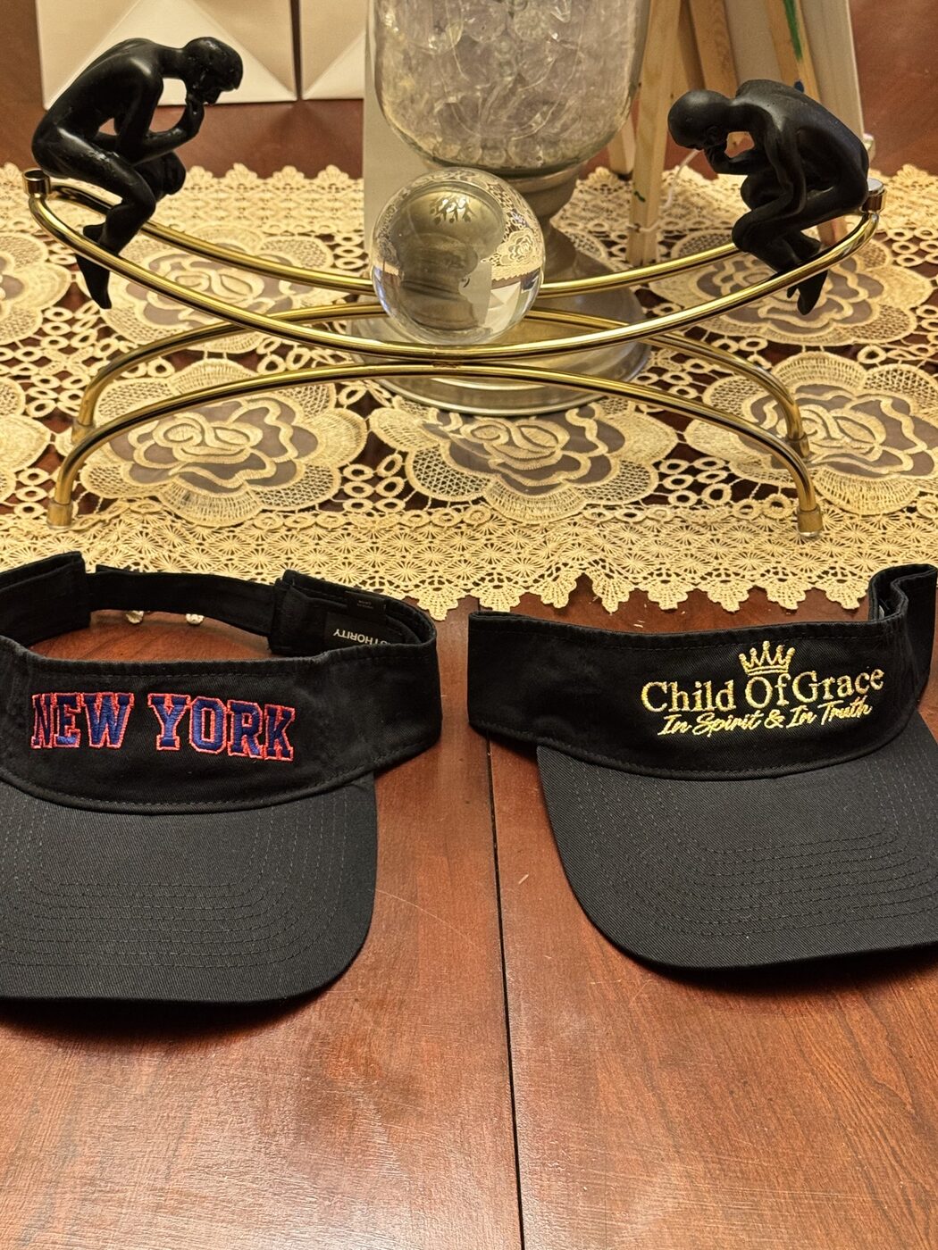 Two CHILD OF GRACE New York embroidered bucket hats displayed together