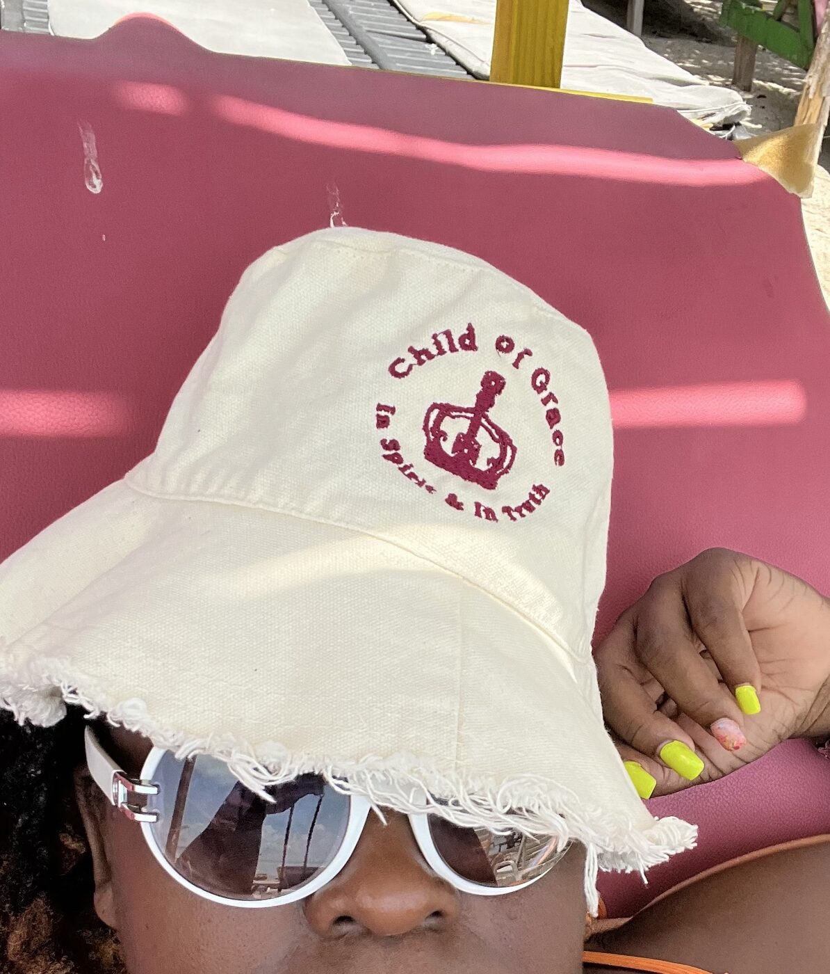 Distressed white CHILD OF GRACE bucket hat with hand-drawn New York lettering